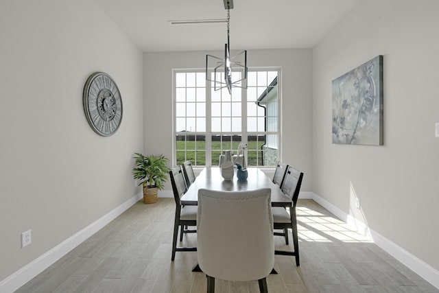 dining room with wood finish floors and baseboards