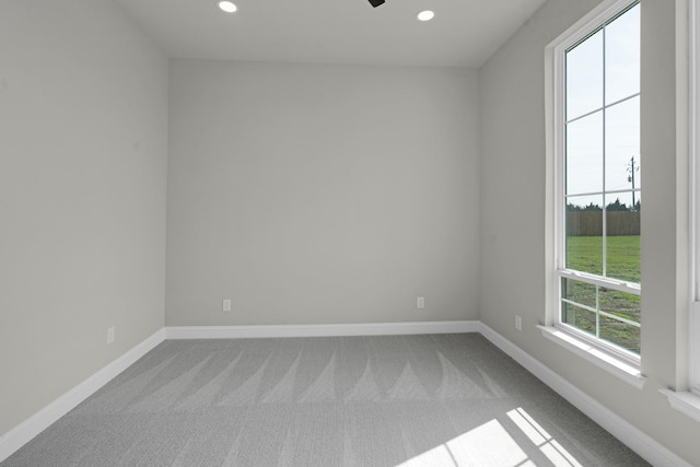 carpeted spare room with baseboards and recessed lighting