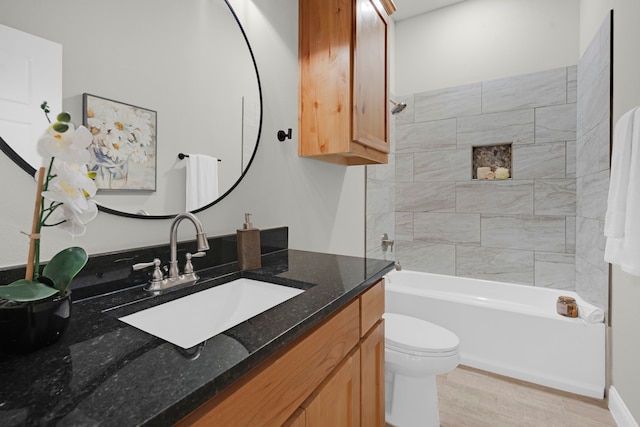 full bathroom with tiled shower / bath, vanity, toilet, and wood-type flooring