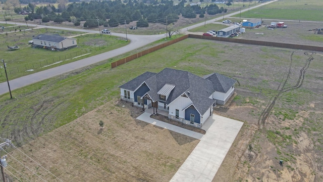 birds eye view of property featuring a rural view