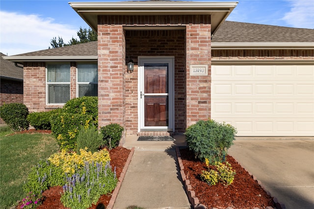 doorway to property featuring a garage