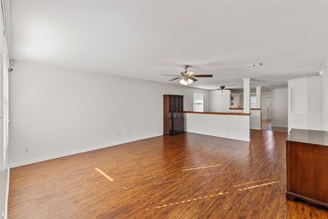 unfurnished living room with crown molding, wood-type flooring, and ceiling fan