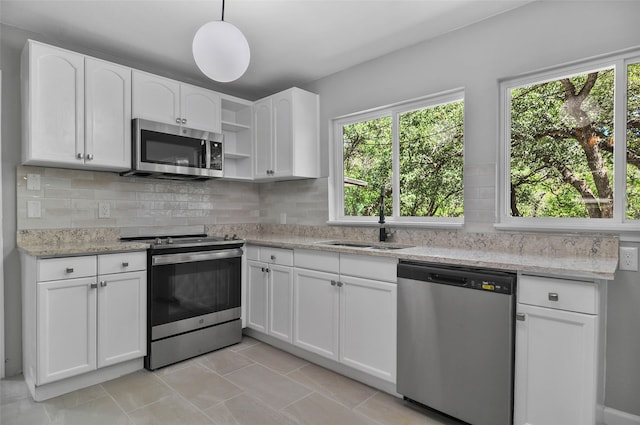 kitchen featuring appliances with stainless steel finishes and white cabinetry