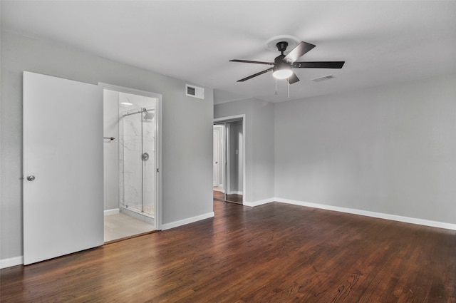 unfurnished room with ceiling fan and dark wood-type flooring