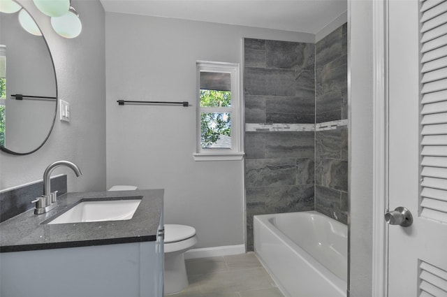 bathroom featuring vanity, toilet, and tile patterned floors