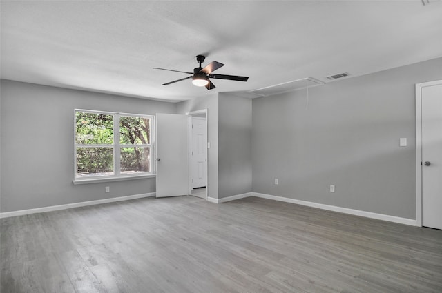 unfurnished room with wood-type flooring and ceiling fan