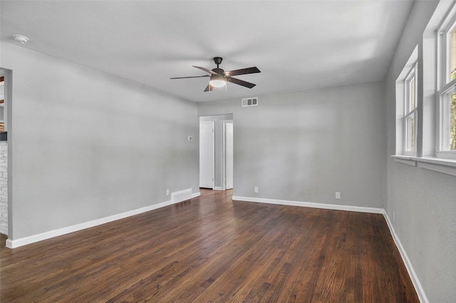 spare room featuring ceiling fan and dark hardwood / wood-style flooring