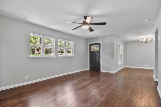 unfurnished living room with dark wood-type flooring and ceiling fan