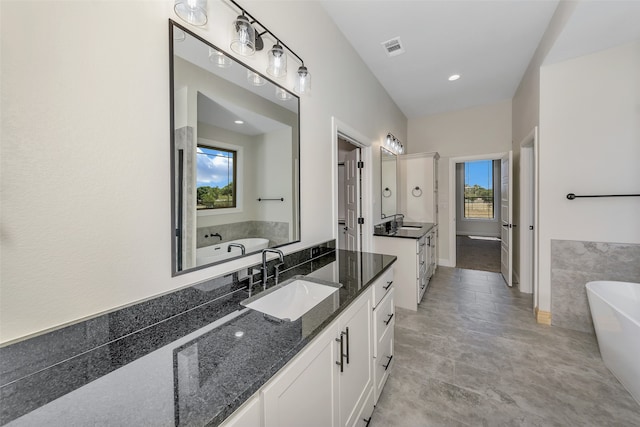 bathroom featuring a bathtub and vanity