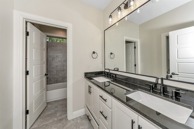 bathroom with tile patterned floors and vanity