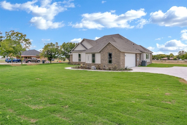 view of front of house featuring a garage and a front lawn