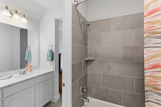 bathroom featuring vanity and washtub / shower combination