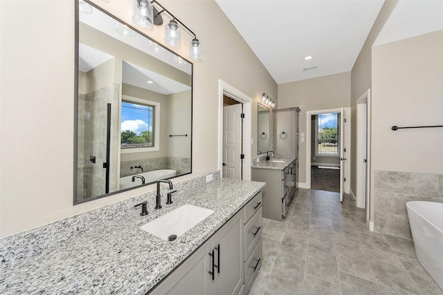 3037 Sunrise Trl, Weatherford, TX 76088 - bathroom with a sink, a freestanding bath, and a wealth of natural light