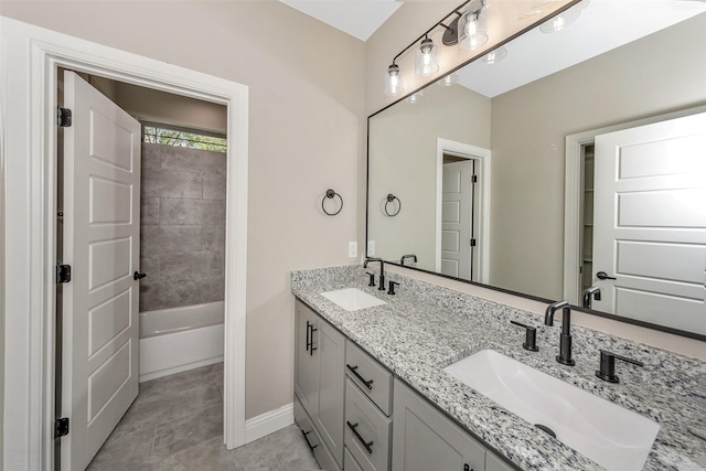 3037 Sunrise Trl, Weatherford, TX 76088 - bathroom featuring a sink, baseboards, double vanity, and tile patterned flooring