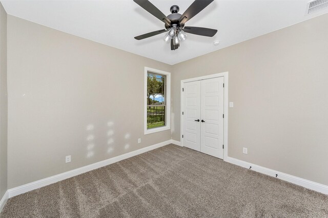 3037 Sunrise Trl, Weatherford, TX 76088 - unfurnished bedroom featuring visible vents, a ceiling fan, a closet, carpet floors, and baseboards