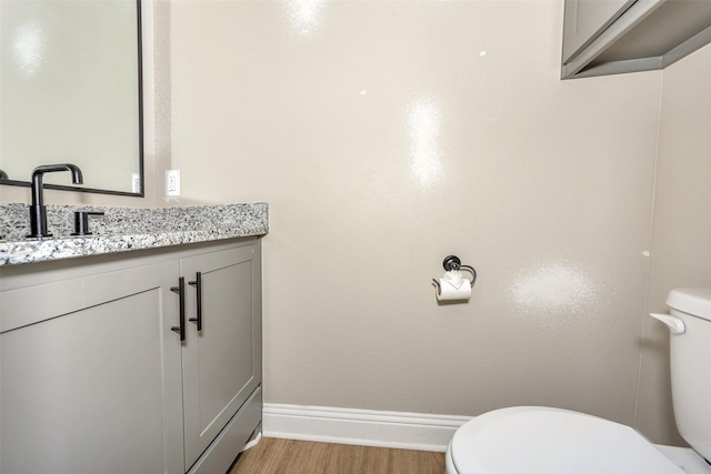 3037 Sunrise Trl, Weatherford, TX 76088 - bathroom featuring toilet, vanity, baseboards, and wood finished floors