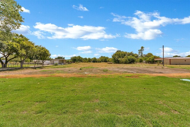 view of yard with a rural view