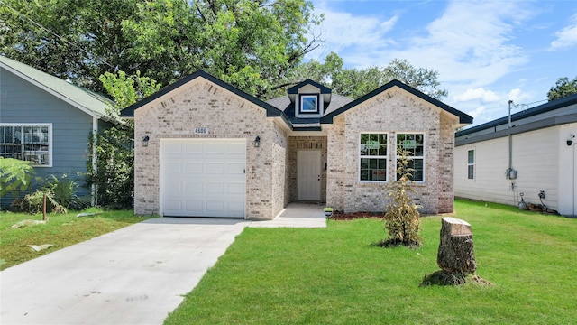 view of front of house with a front yard and a garage