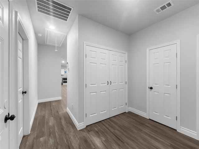 unfurnished bedroom featuring dark hardwood / wood-style flooring