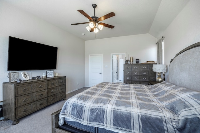 carpeted bedroom with ceiling fan and vaulted ceiling