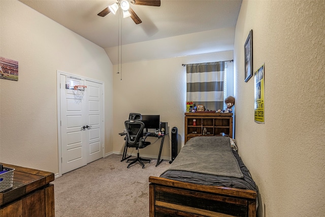 carpeted bedroom with lofted ceiling, a closet, and ceiling fan