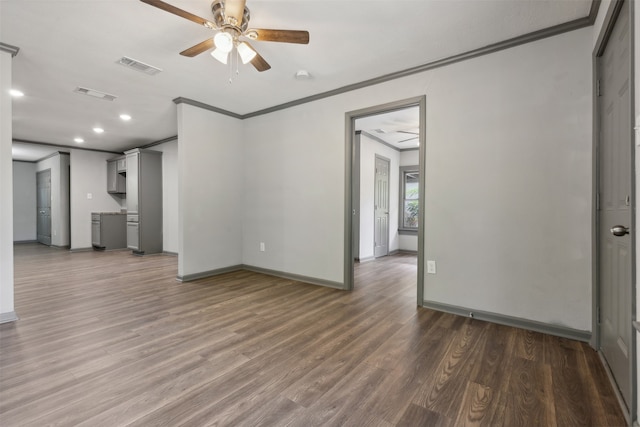 spare room featuring ceiling fan, hardwood / wood-style flooring, and ornamental molding