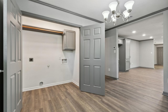 washroom with hookup for a gas dryer, hookup for a washing machine, dark wood finished floors, and hookup for an electric dryer