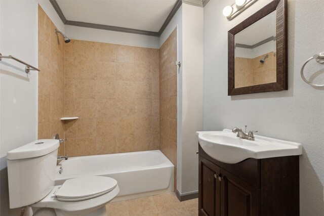 full bathroom with tiled shower / bath, tile patterned floors, toilet, vanity, and ornamental molding