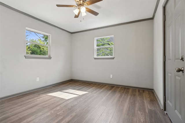 spare room with ornamental molding, hardwood / wood-style floors, and ceiling fan