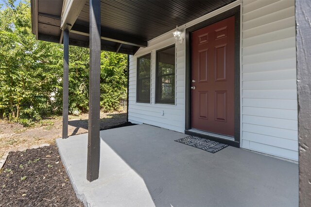 doorway to property with a patio