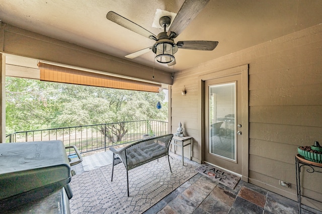 view of patio / terrace featuring a balcony and ceiling fan