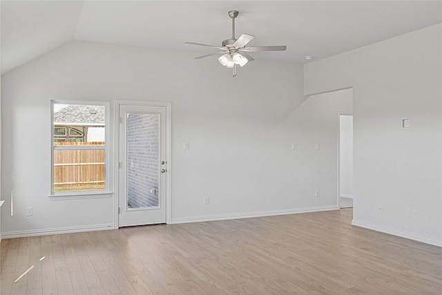 unfurnished living room featuring lofted ceiling, ceiling fan, and light hardwood / wood-style flooring