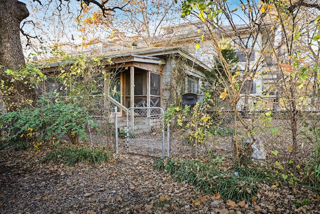 view of outbuilding with a sunroom