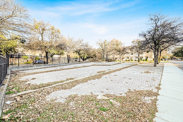 view of yard with a residential view and fence