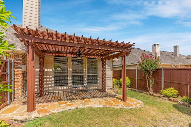 view of patio featuring ceiling fan and a pergola