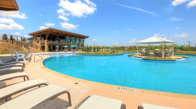 view of swimming pool with a gazebo and a patio area