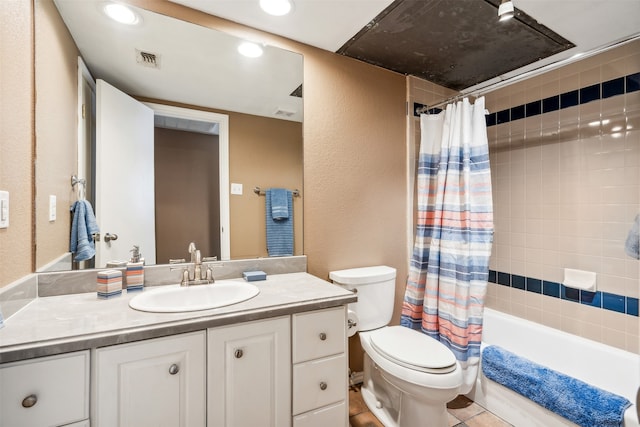 full bathroom featuring vanity, toilet, shower / bath combo with shower curtain, and tile patterned flooring