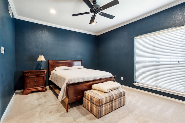 bedroom with ornamental molding, light colored carpet, and ceiling fan