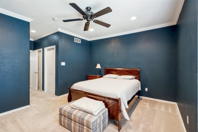 carpeted bedroom featuring ornamental molding and ceiling fan