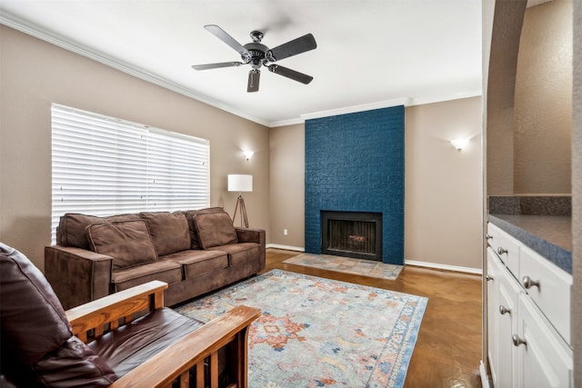 living room featuring ornamental molding, a fireplace, and ceiling fan