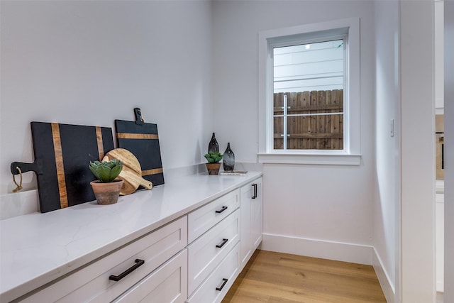 details with baseboards and wood finished floors