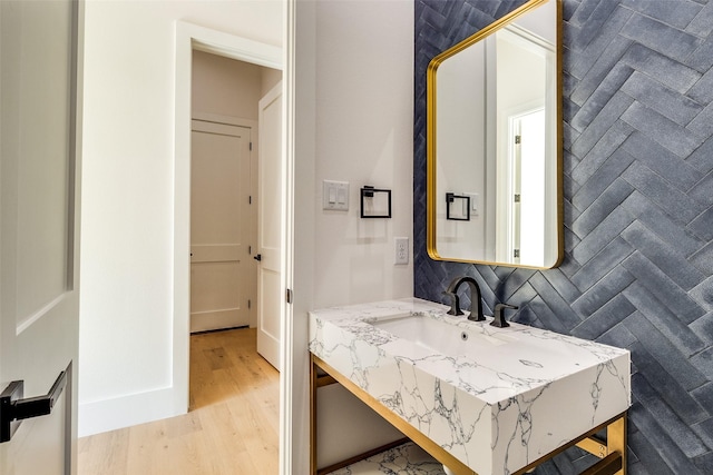 bathroom with vanity and wood finished floors