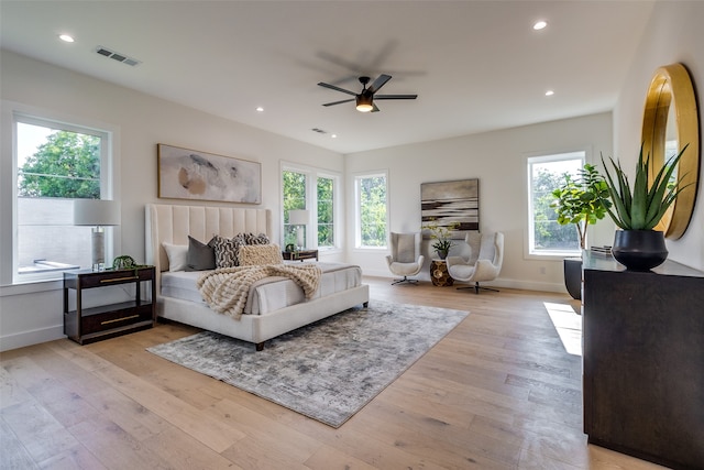 bedroom with light wood-type flooring and ceiling fan