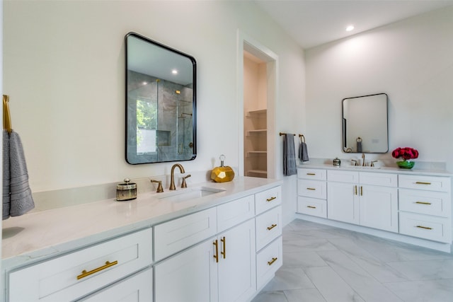 bathroom with vanity, recessed lighting, a stall shower, and marble finish floor