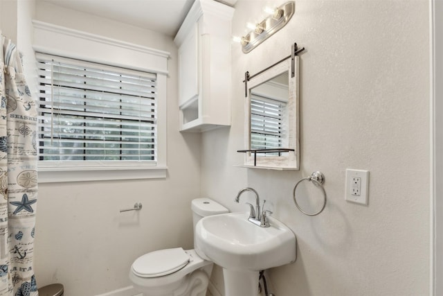 3018 Scorpio Dr, Granbury, TX 76049 - bathroom featuring toilet and baseboards