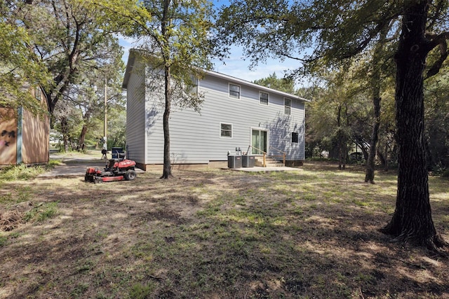 3018 Scorpio Dr, Granbury, TX 76049 - back of property featuring cooling unit