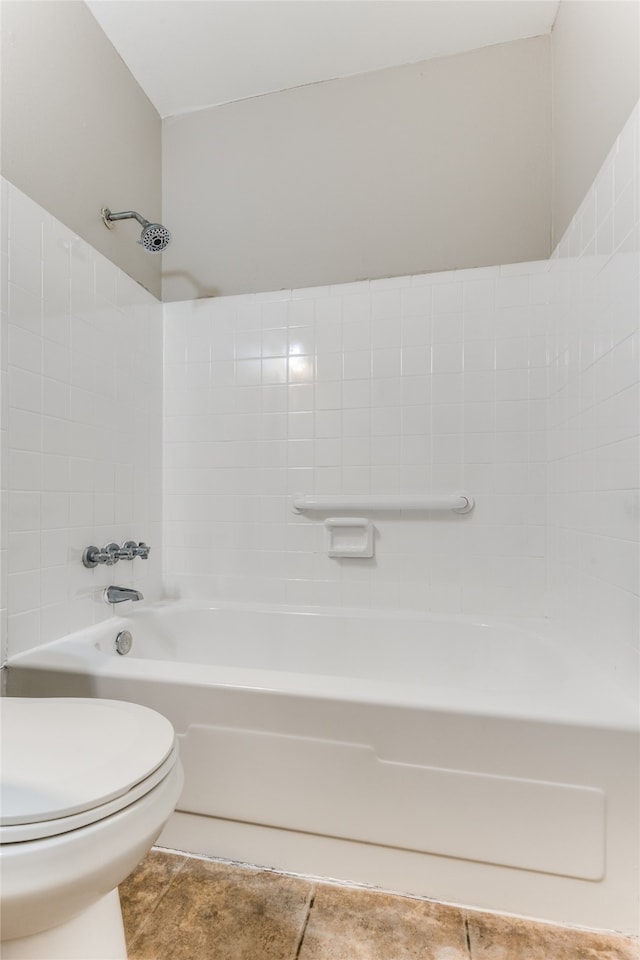 bathroom with shower / bathtub combination, toilet, and tile patterned floors