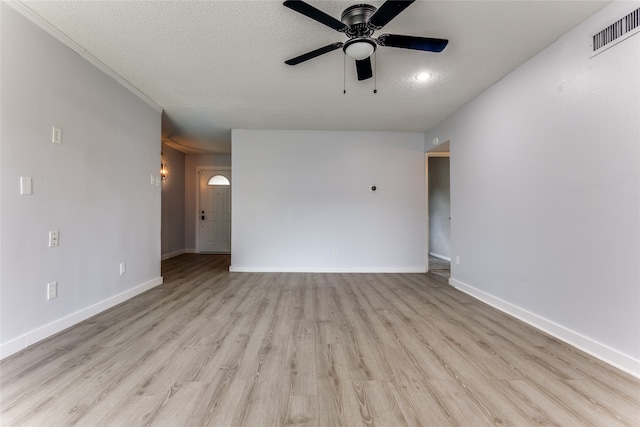 unfurnished room featuring a textured ceiling, ceiling fan, and light hardwood / wood-style floors