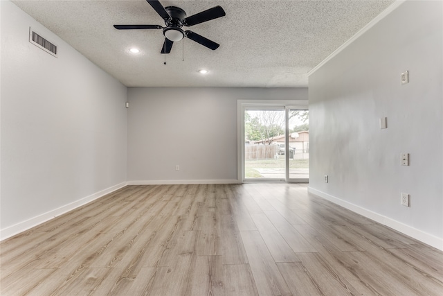 empty room featuring ceiling fan, a textured ceiling, and light hardwood / wood-style flooring