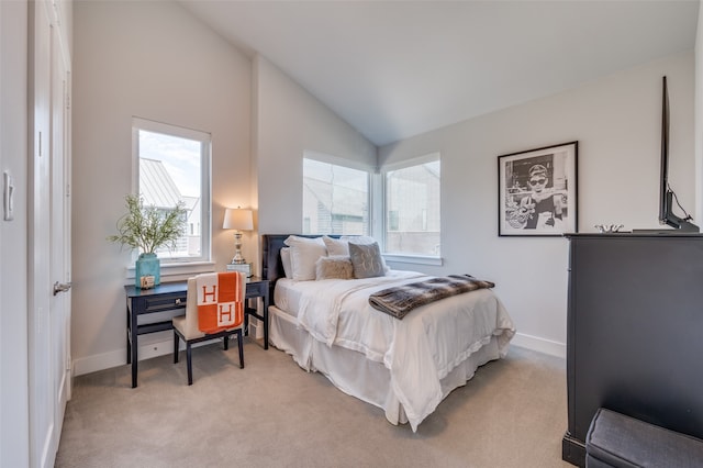 carpeted bedroom with vaulted ceiling